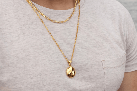 Men's Jewellery, model wearing gold locket and gold men's chain