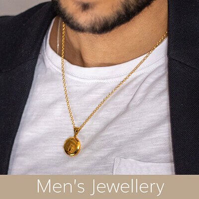 man wearing round gold necklace on belcher chain