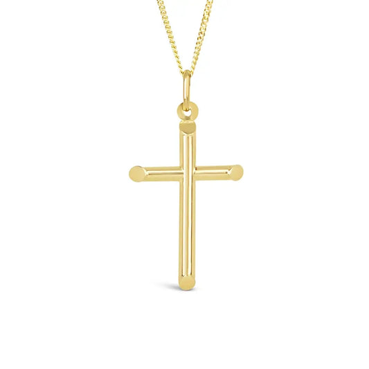 Close-up product image of a polished gold cross pendant necklace on a fine chain against a white background