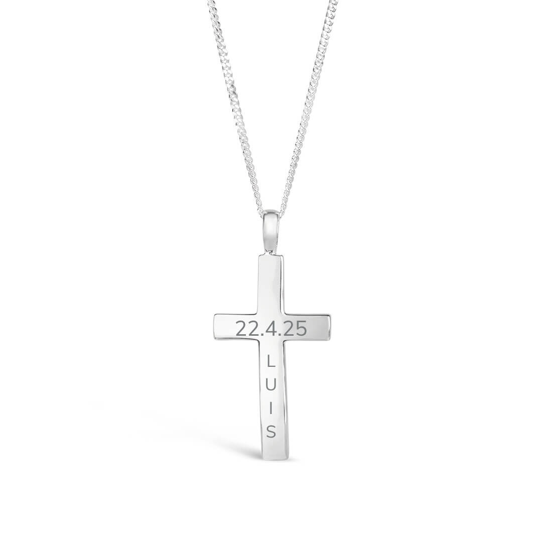 Silver cross pendant with engraved text onreverse on a white background