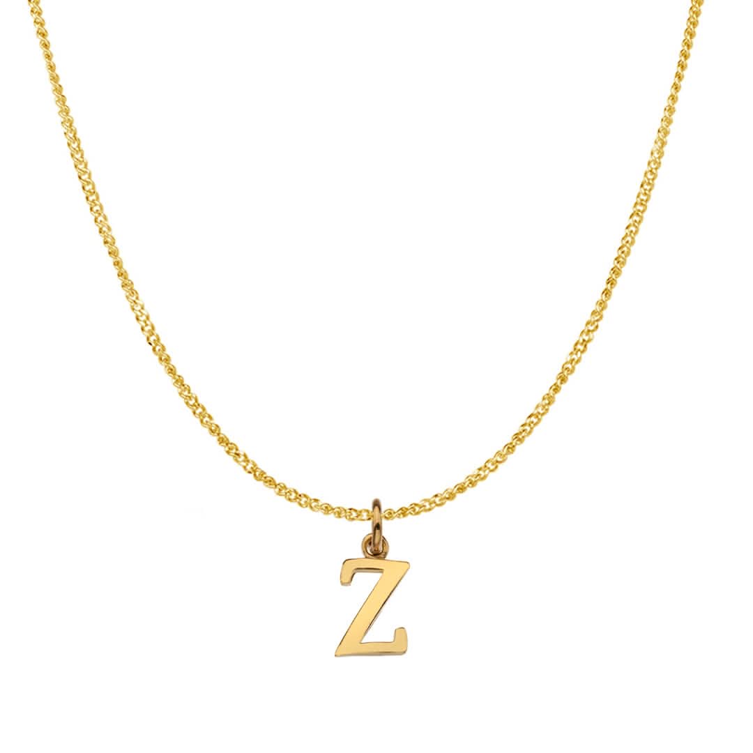 An alphabet initial necklace 'Z' in solid 9 carat gold hanging on a solid 9 carat gold close curb chain with a white background
