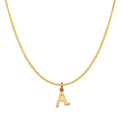 Alphabet initial necklace in solid gold on a curb chain