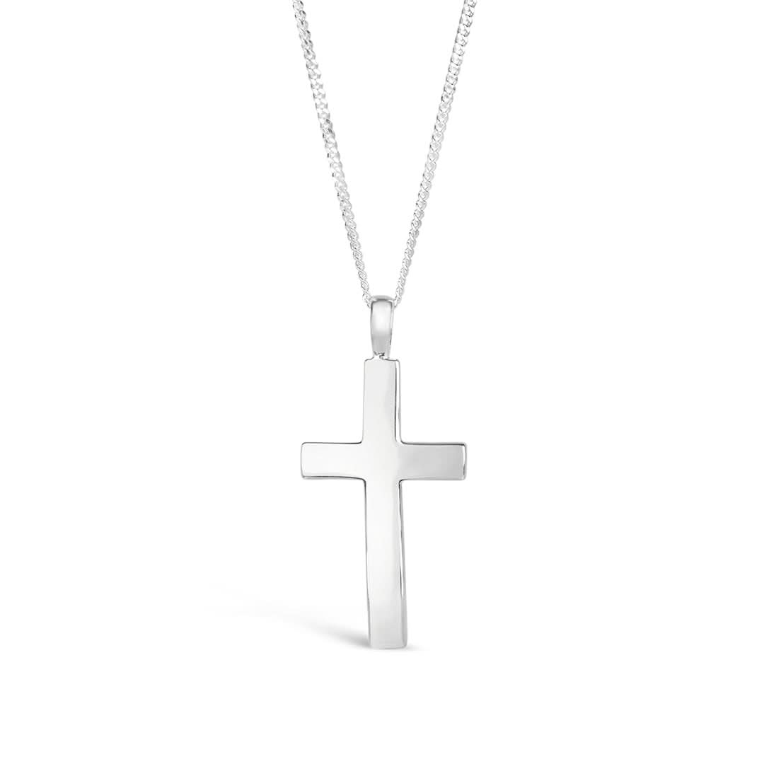 image of a heavy weight silver cross necklace from the back, hanging on a curb chain, against a white background