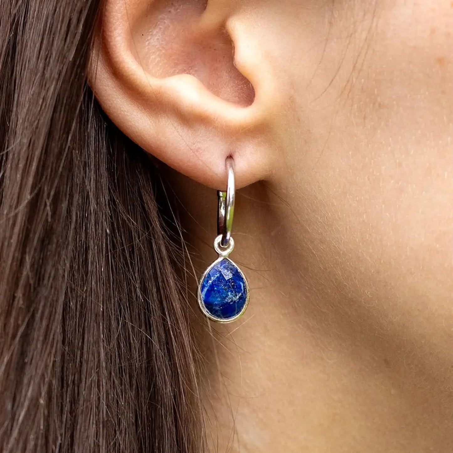 model wearing lapis lazuli silver drop op earrings