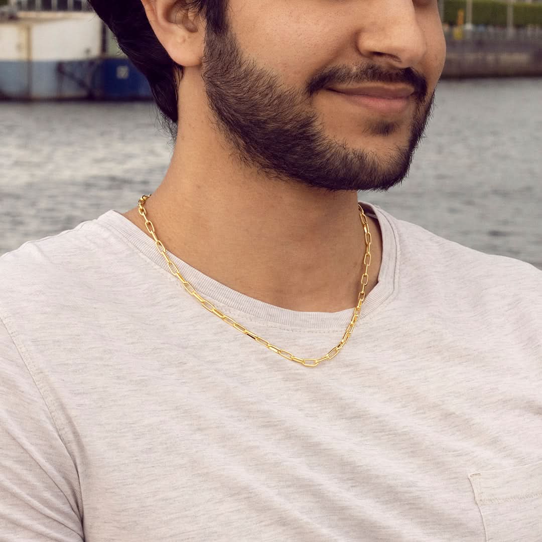 male model wearing paperclip gold chain necklace