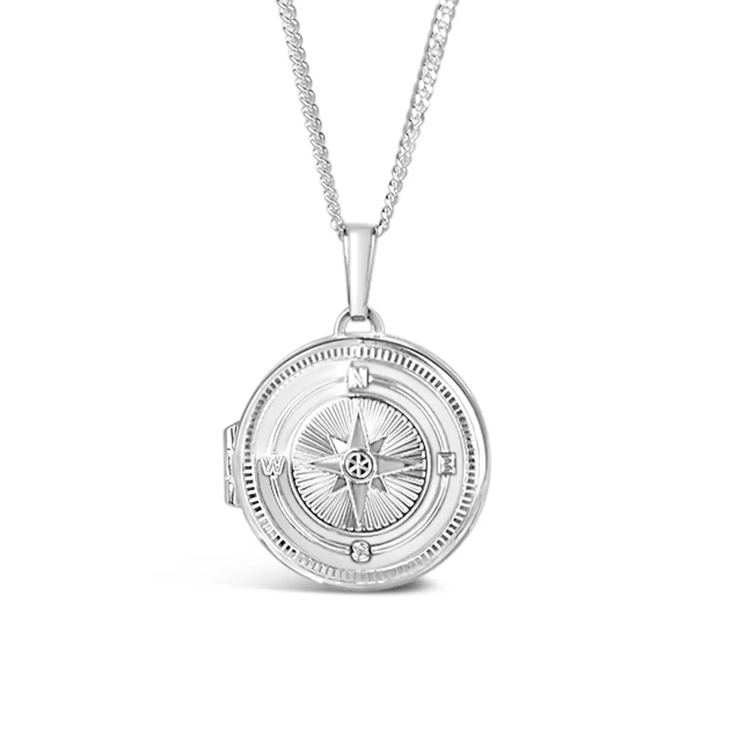 close up of a Silver compass pendant necklace on a white background