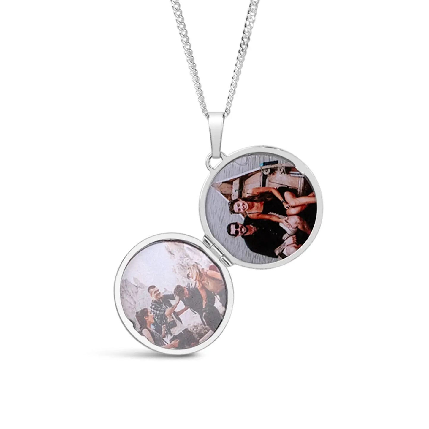 Silver locket with two round photo panels on a white background