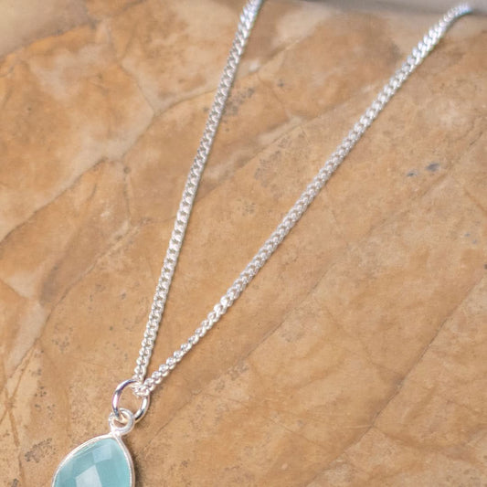 white gold curb chain on flatlay surface