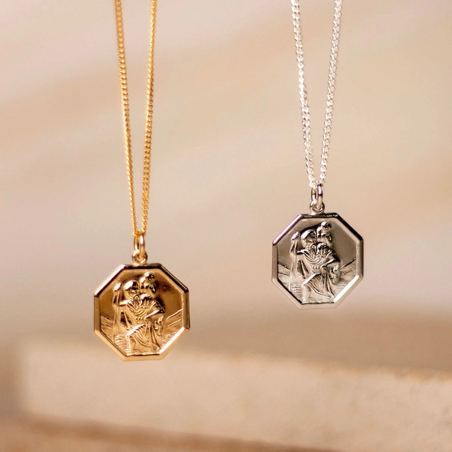 octagonal solid gold st christopher necklace with raised relief and matching silver St Christopher necklace