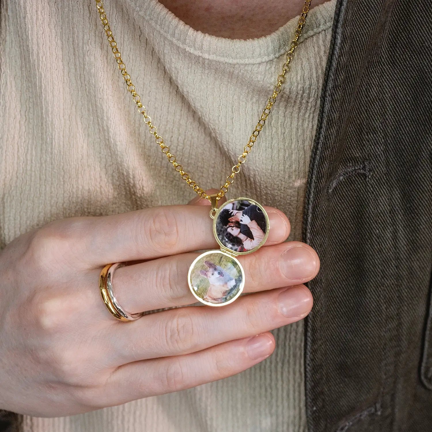 photograph of st christopher locket in gold showing the inside of the locket on a male model