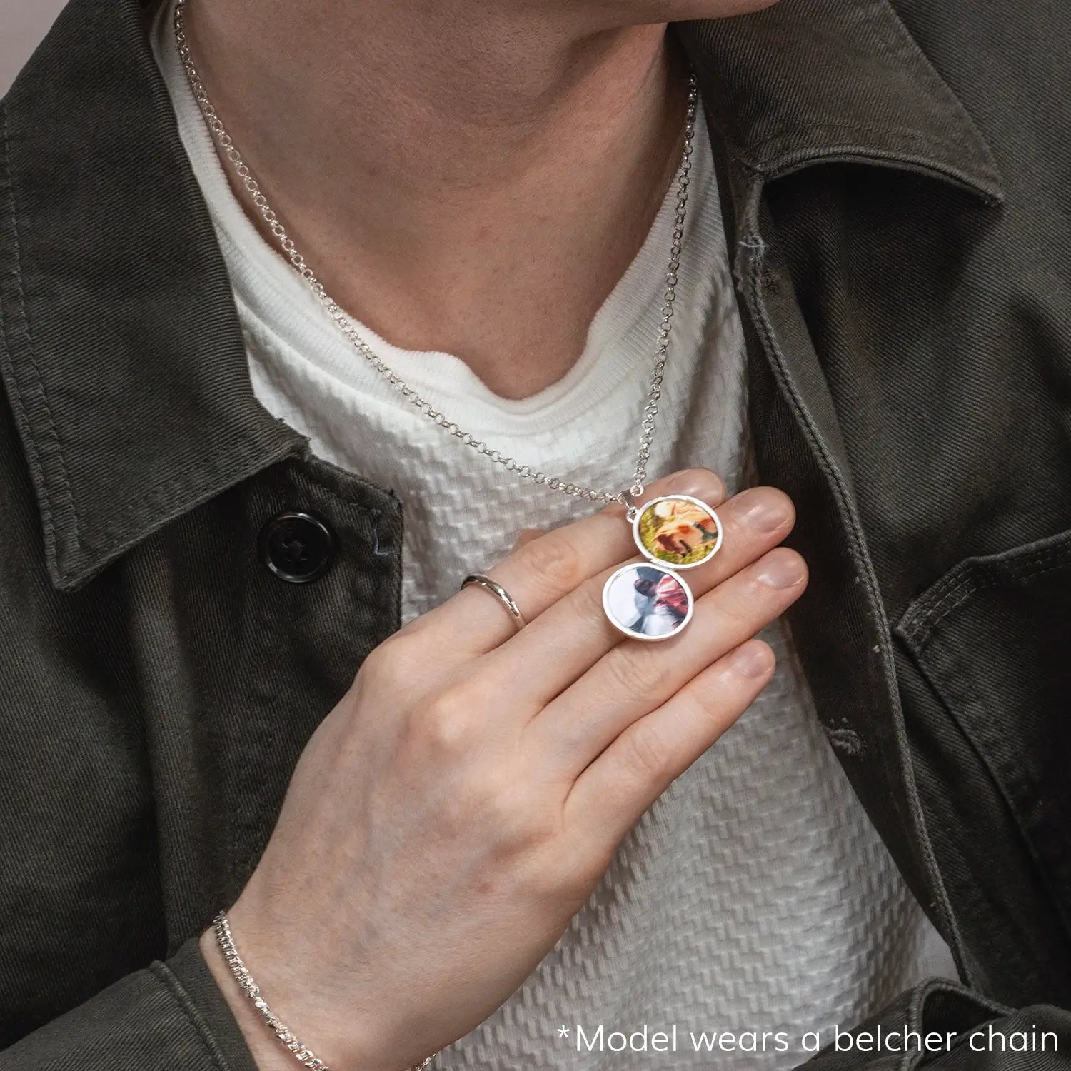 photograph of st christopher locket in silver showing the locket open and worn on a male model