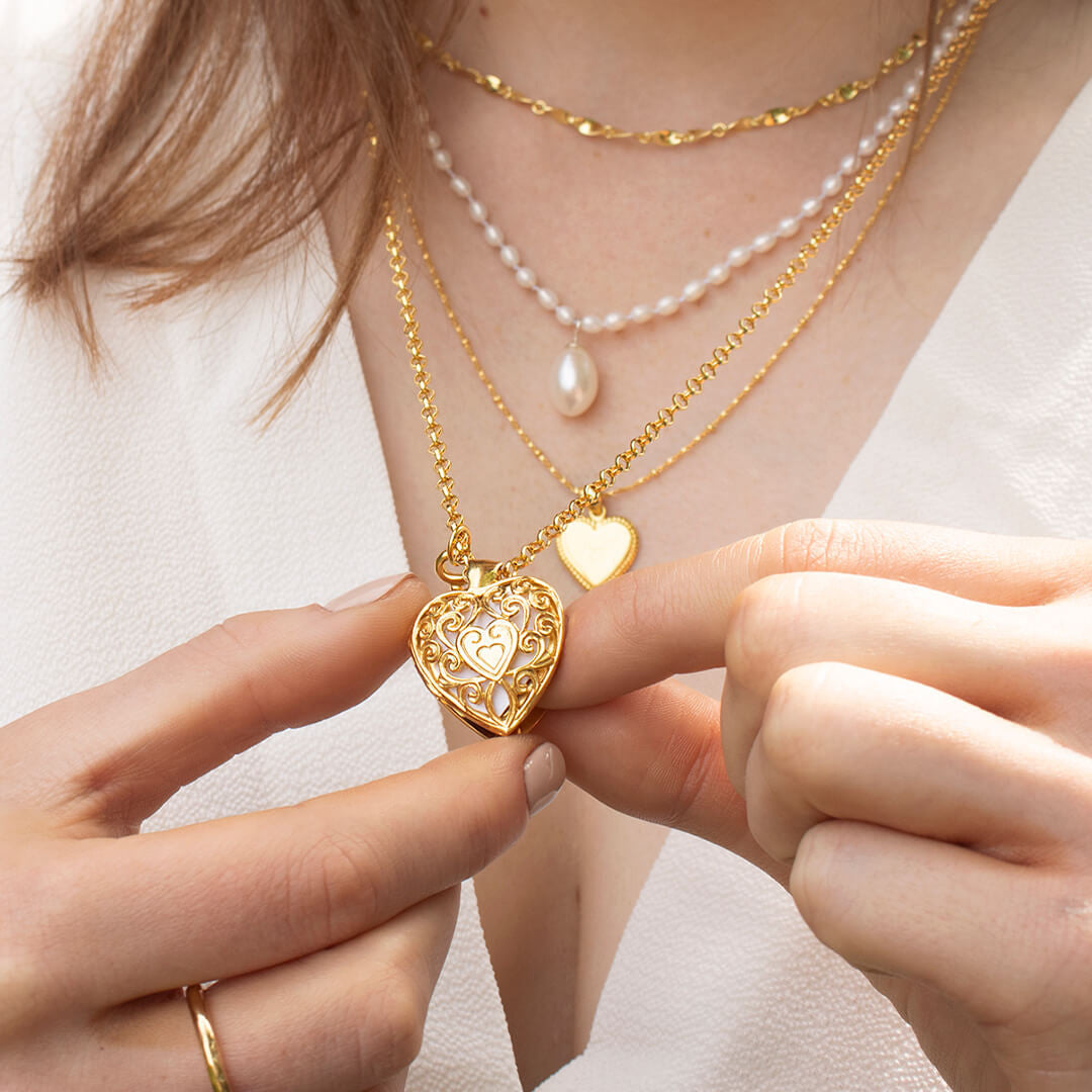 model wearing heart locket in gold