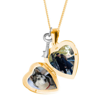 opened key locket in gold with family photos inside on a white background