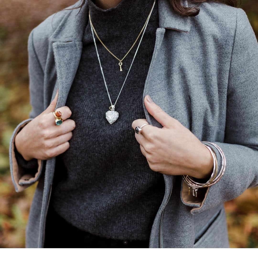 model wearing key pendant in silver
