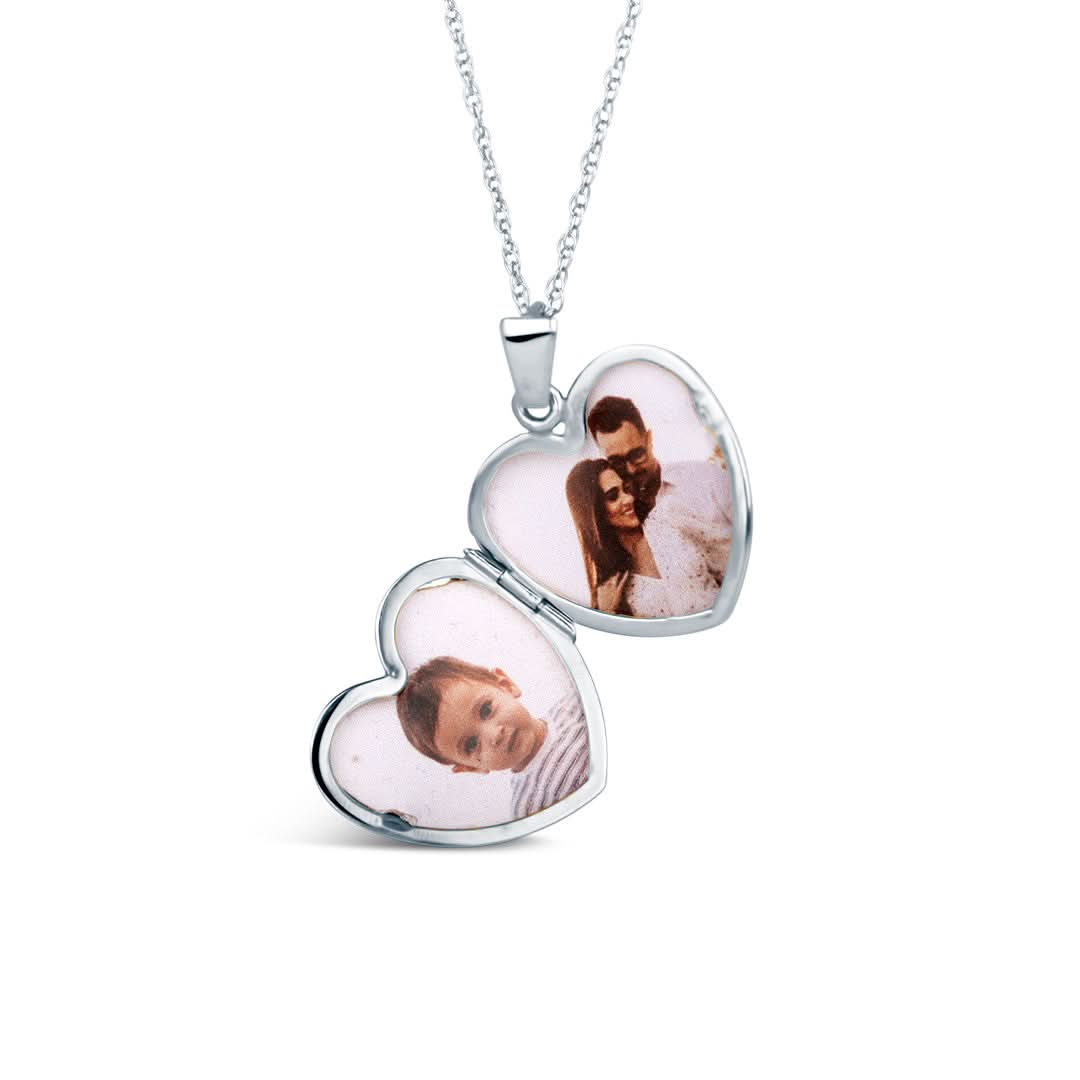 opened diamond heart locket in white gold with family photos inside