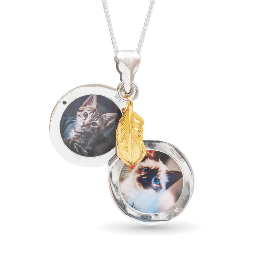opened feather locket in silver with gold feather charm in silver