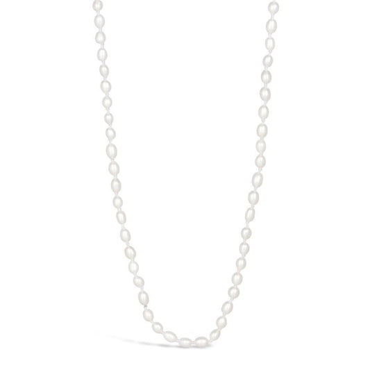 Ivory seed pearl necklace on a white background