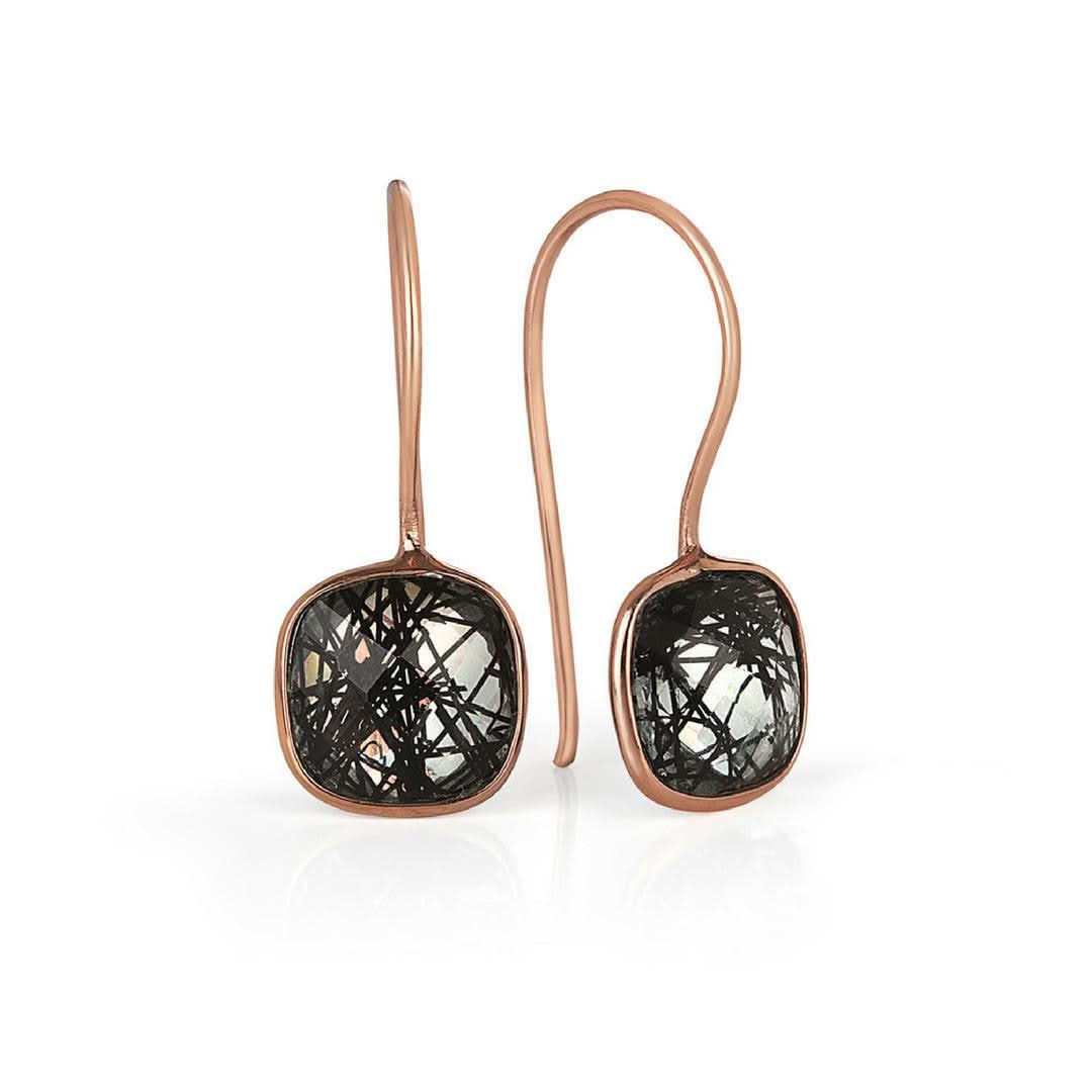 rutilated quartz cocktail ring in rose gold on a white background