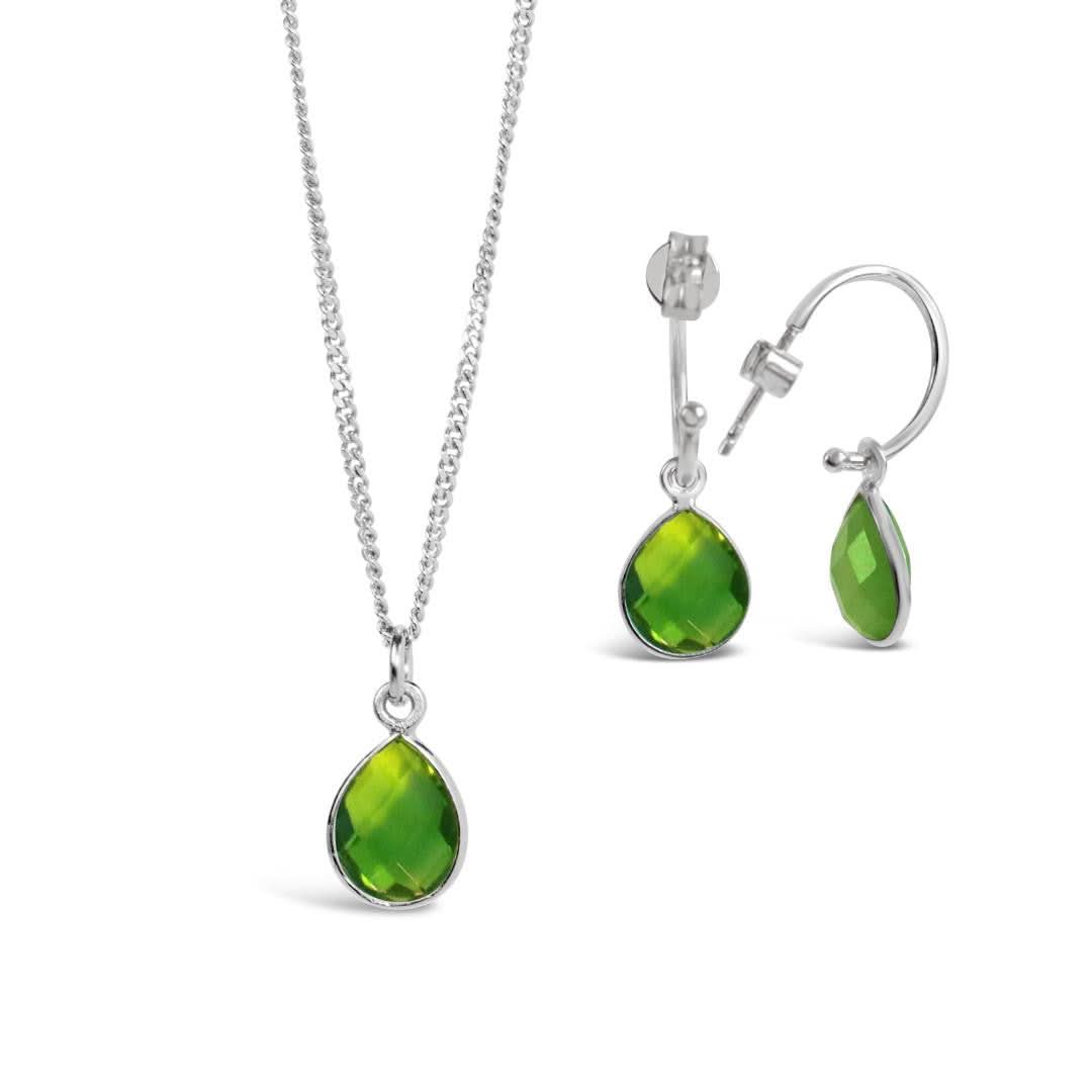 peridot drop hoop earrings in silver on a white background