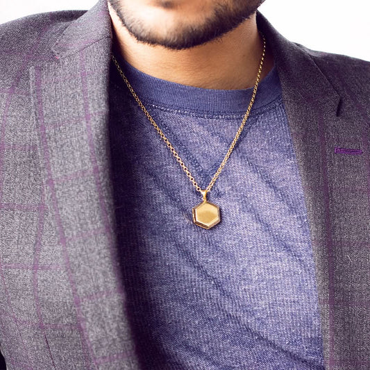 model wearing men's hexagon locket in gold