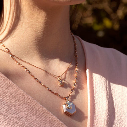 model wearing bee locket in rose gold with bee charm