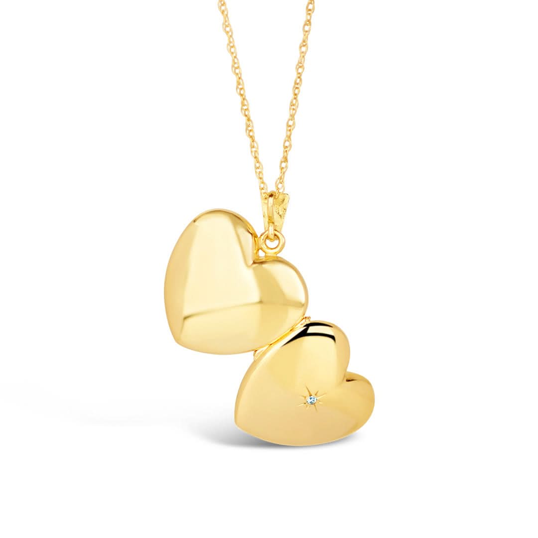 opened diamond heart locket in gold with front and back view of the locket