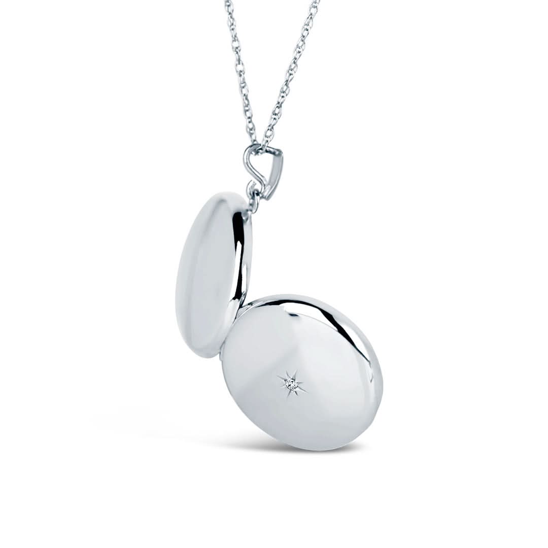 opened white gold round diamond heart locket showing back and front of locket
