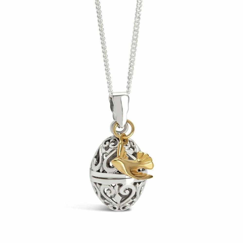bird locket in silver with gold bird charm on a white background