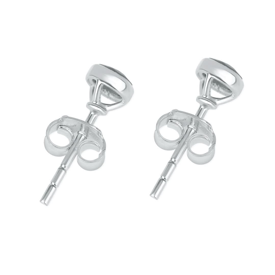 Pink opal stud earrings in silver facing the back on a white background