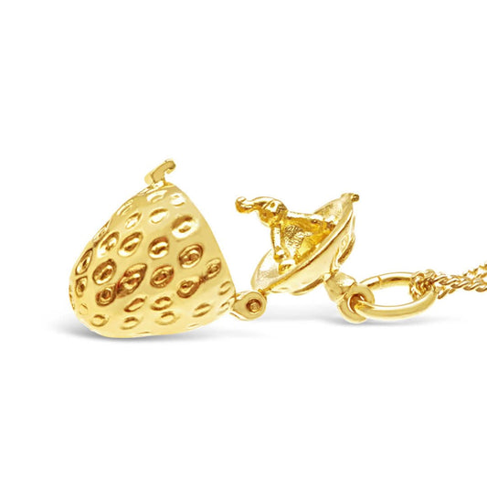 opened magical strawberry charm on a white background