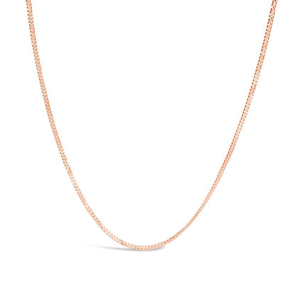 rose gold curb chain on a white background