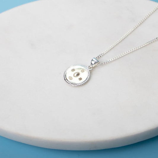 Limited Edition King Charles III Coronation Necklace featuring the Commemorative Hallmark on a white dish