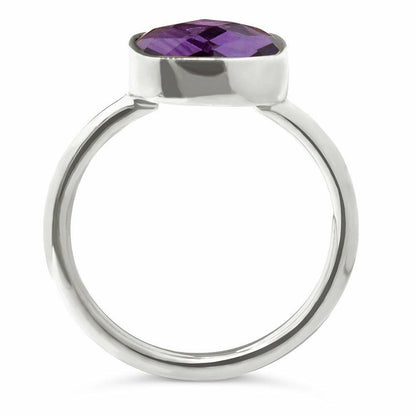 close up of purple amethyst cocktail ring in silver on a white background
