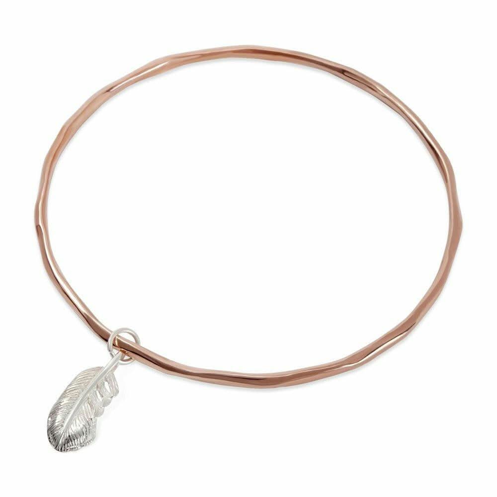 rose gold bangle with silver feather charm attached