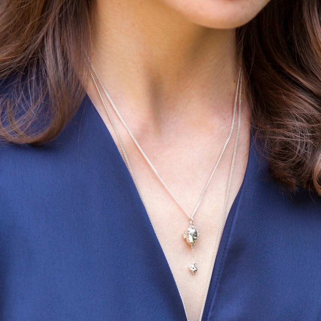 model wearing magical squirrel charm