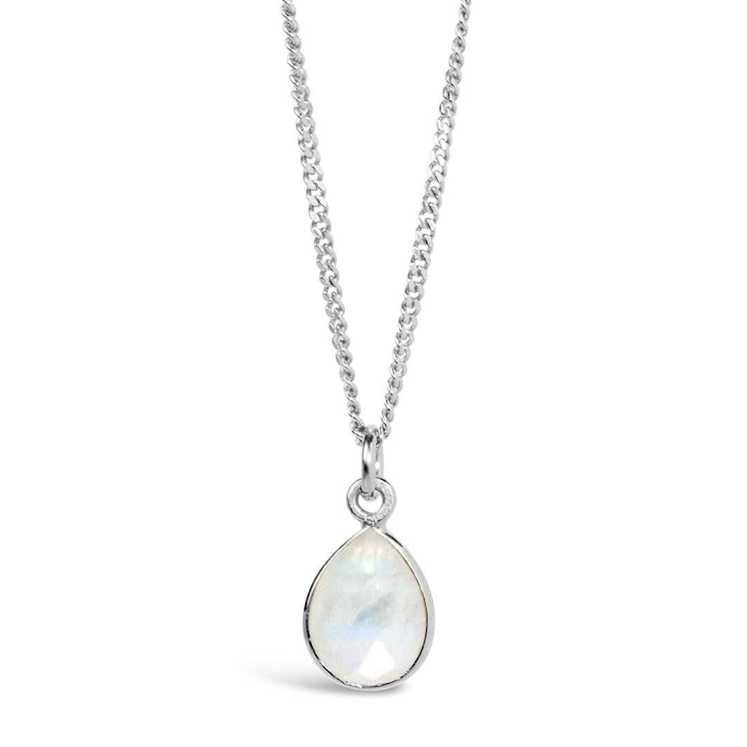 white quartz charm necklace in silver on a white background