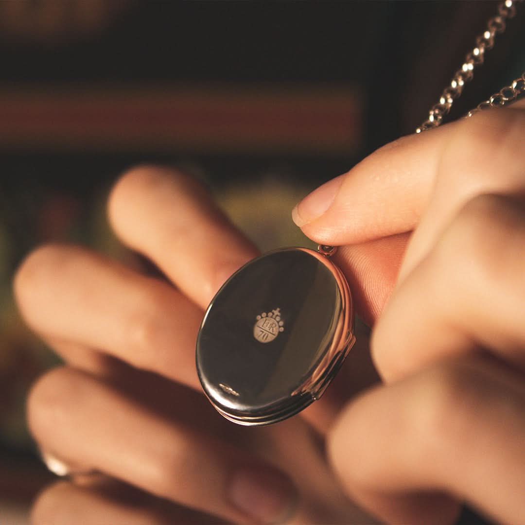 closeup of model wearing Queen Elizabeth locket