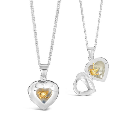 gold song in my heart locket on a white background