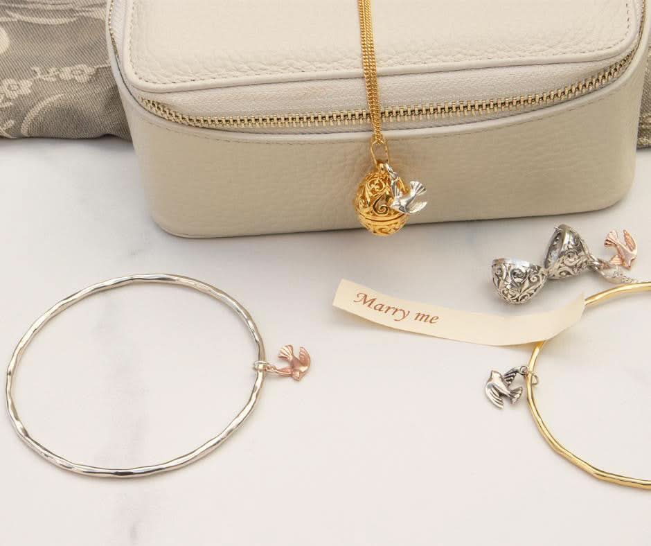 collection of jewellery with bird charms attached