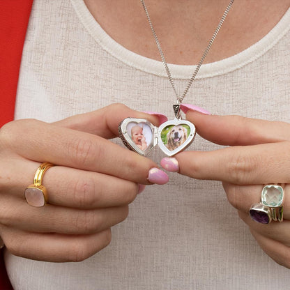 model holding white gold vintage heart locket with garnet gemstone with photos