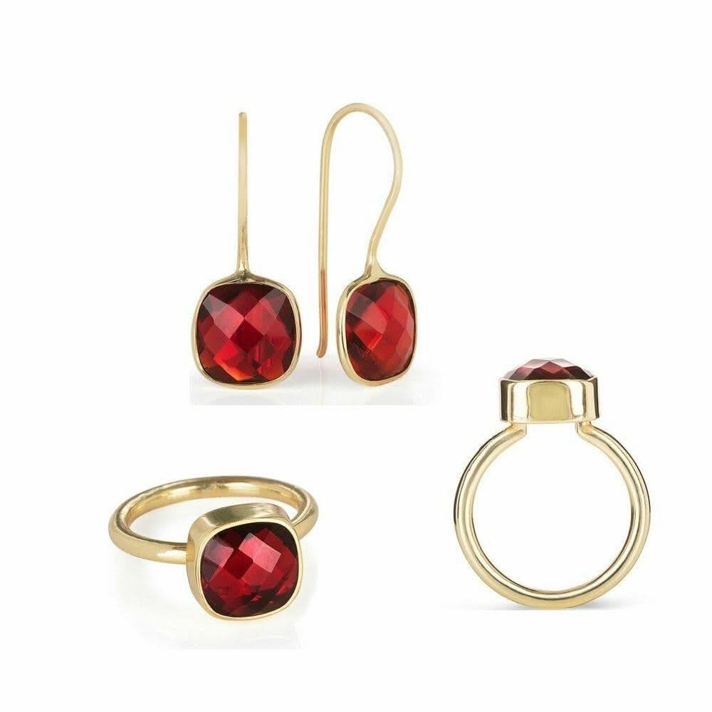 garnet earrings and cocktail ring on a white background