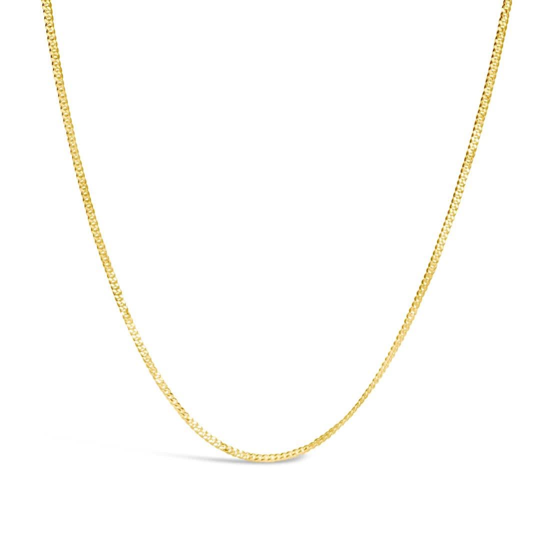 gold curb chain on a white background