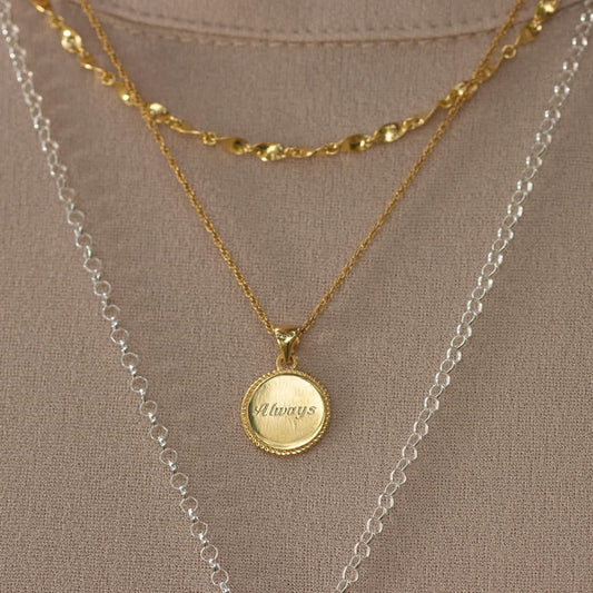 model wearing gold rope chain with engravable disc