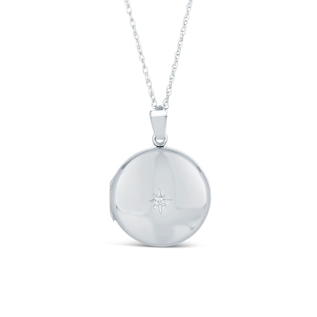 solid white gold round diamond locket on a white background