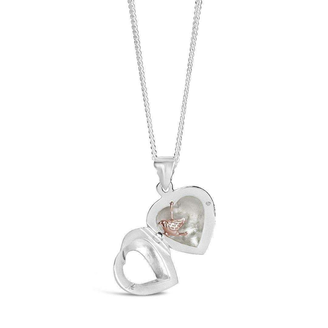 opened song in my heart locket in rose gold on a white background