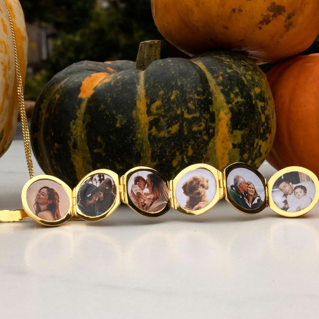 opened memory keeper locket with photos Infront of pumpkin