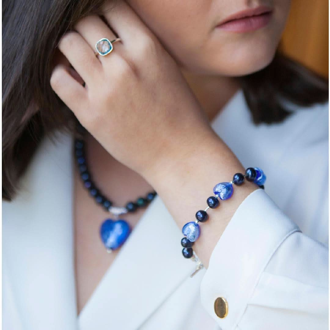model wearing midnight pearl heart bracelet and necklace