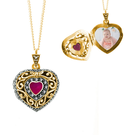 ruby vintage heart locket in gold with photo inside on a white background