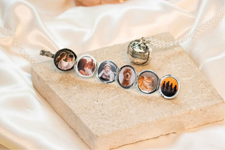 silver locket filled with photos