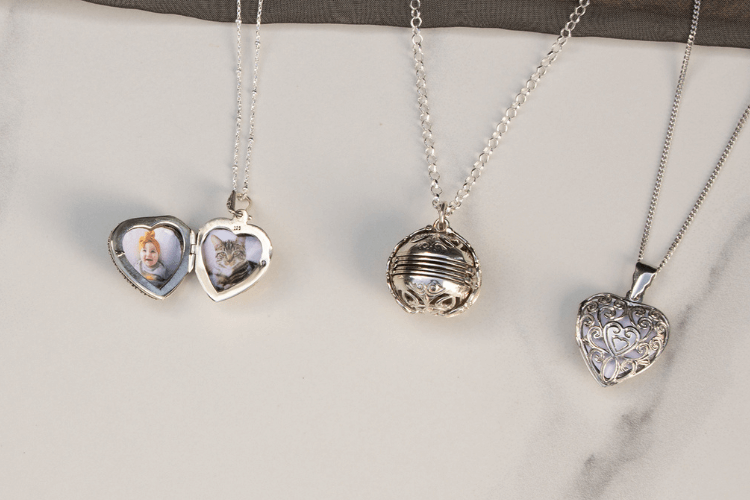 silver heart locket, silver round locket and silver filigree heart locket on curb chains with photos inside